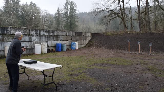 Shooting in the rain and cold with a red dot on a handgun